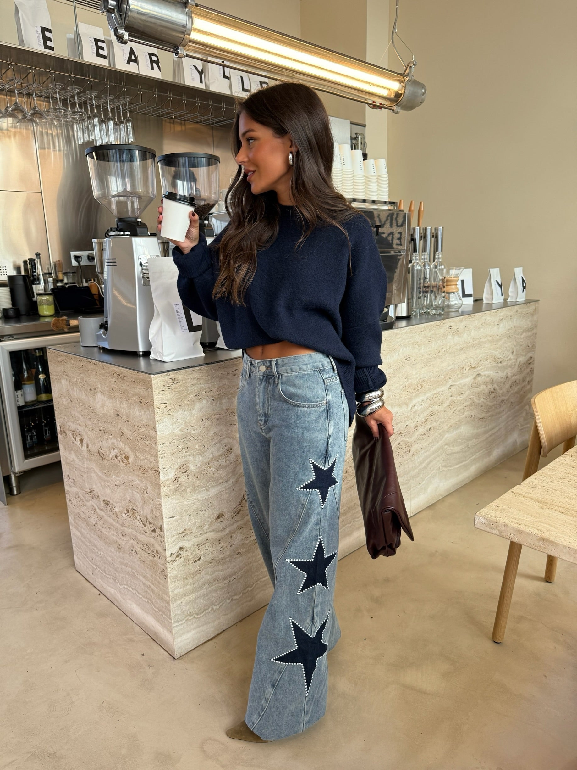 Jeans con stelle ricamate