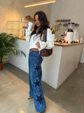Jeans con stelle ricamate, tonalità blu notte